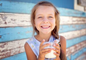 Girl drinking glass of milk