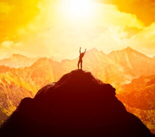 Climber at top of peak