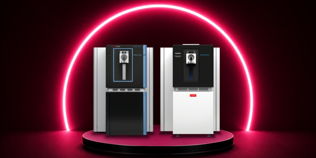 Two Thermo Scientific Orbitrap mass spectrometers displayed on a platform with a glowing neon backdrop.
