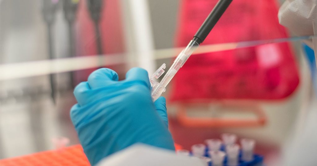 Technician preparing a protein sample for cryo EM analysis