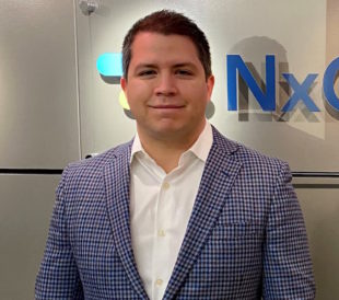 Adam Goodman of NxMdx, a man wearing a plaid blazer, explains his comparison of ReproSeq and VeriSeq