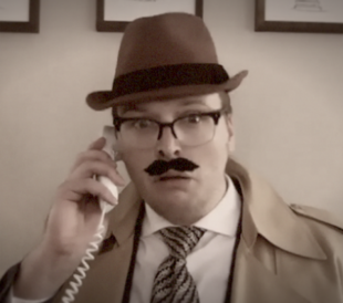 A detective looks straight into the camera