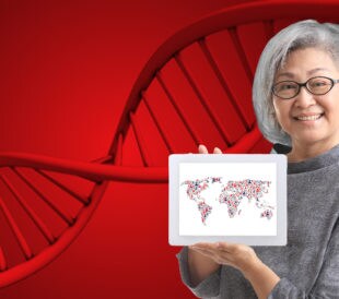 woman holding up placard picture of world map and predictive genomics