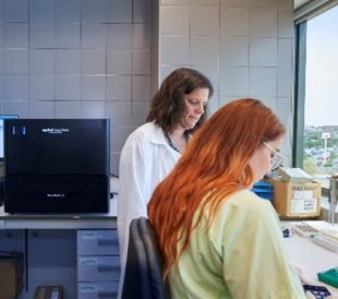 Scientists working in lab.