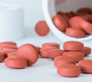 Ibuprofen Tablets Spilled from a Bottle