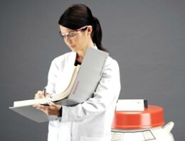 biobank professional with binder and cryo container