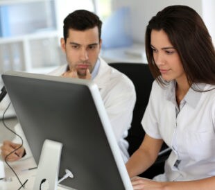 Two scientists filling out an online survey. Image: Goodluz/Shutterstock.com