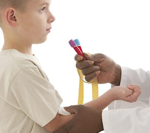 Young child giving a blood sample. Image: JPC-PROD/Shutterstock.com