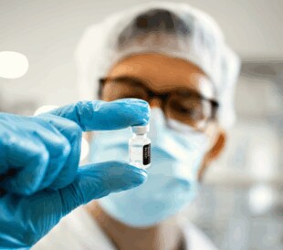 lab-tech-holding-vial