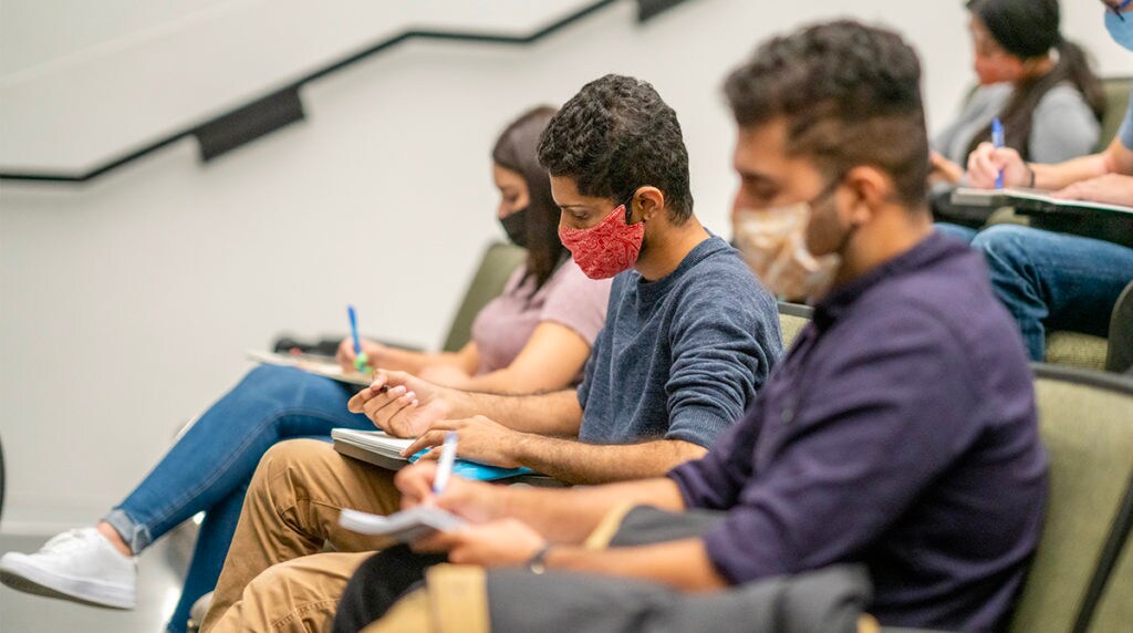 Students in a classroom wearing masks