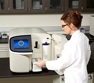 Scientist using Sequencer in lab