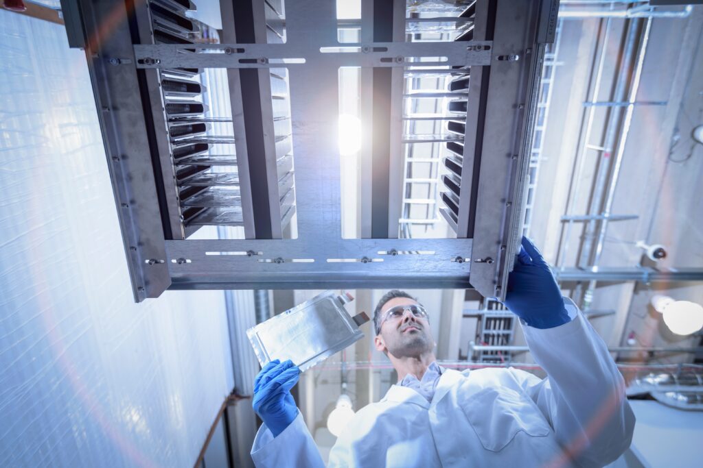 Scientist with lithium ion pouch cell manufacture