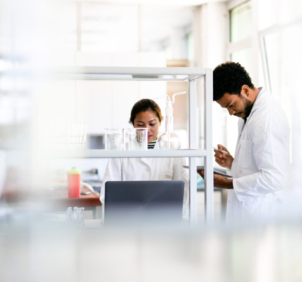 Female and male scientist working in a laboratory setting