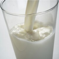 milk pouring into a glass