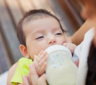 Baby with milk formula