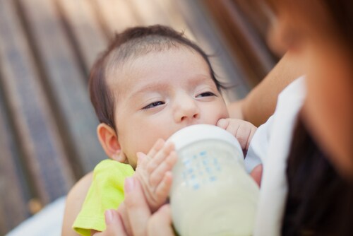 Baby with milk formula
