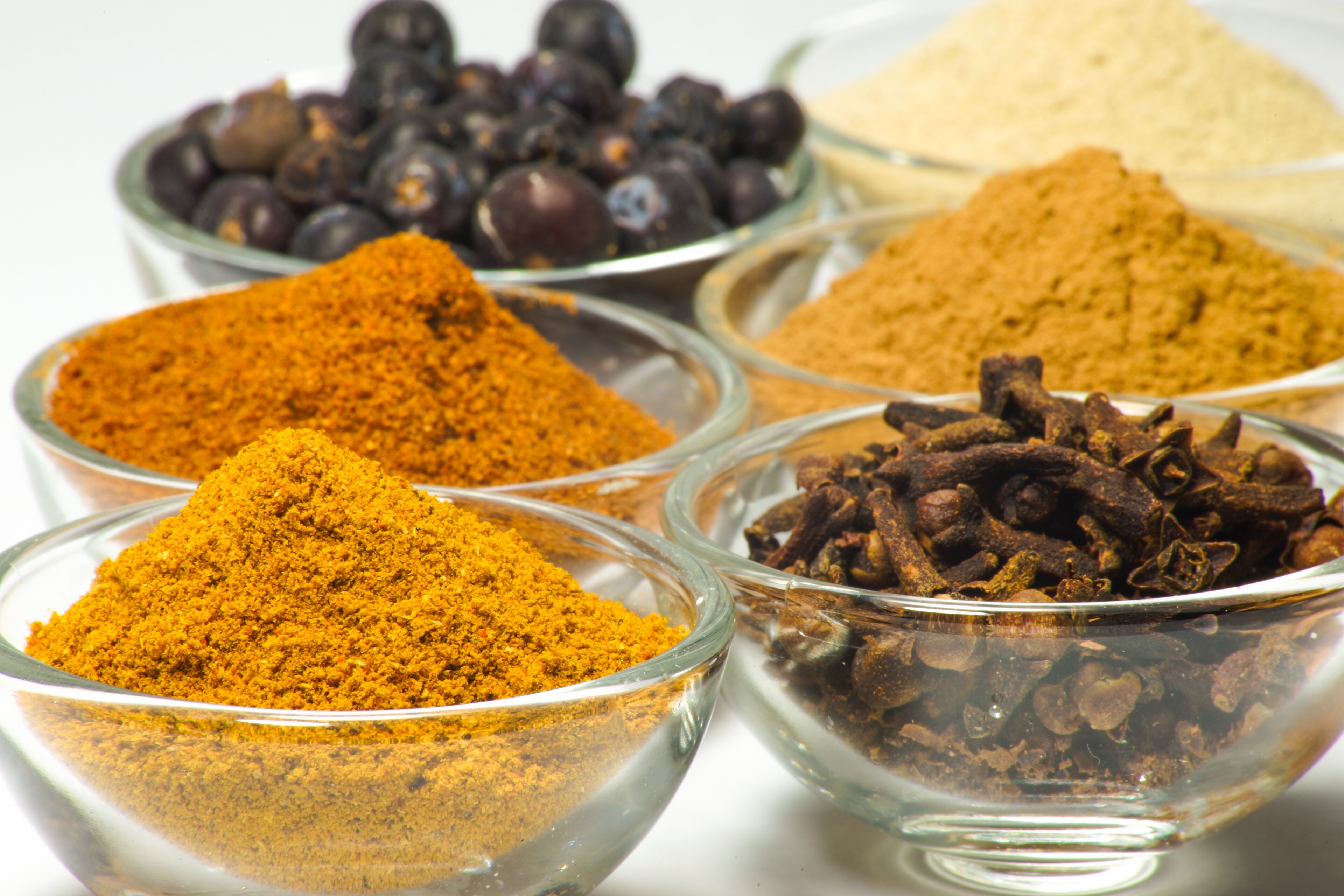 Bowls of colorful spices, which are commonly used in food fraud.