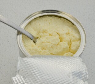 Meticulous detail of a powdered milk can, perfect for baby feeding related projects.