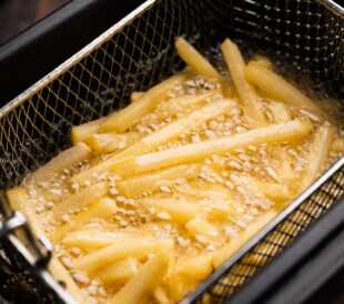 friing potatos in fryier for french fries