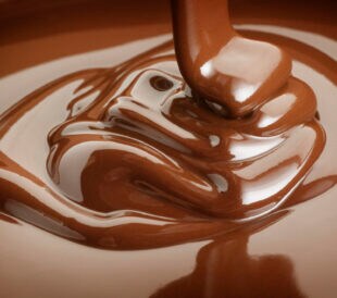 Ribbons of melted chocolate being poured