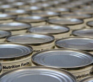food cans showing nutrition facts labels.