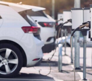 A parking lot with charging stations for electric cars.