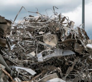 Scrap metal heap. Discarded material sorted and prepared for recycling.