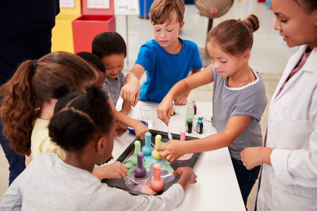 School kids taking part in experiment at science centre