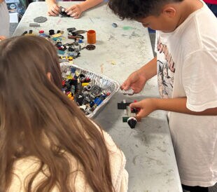 Students at a Carlsbad, CA elementary school build block airplanes