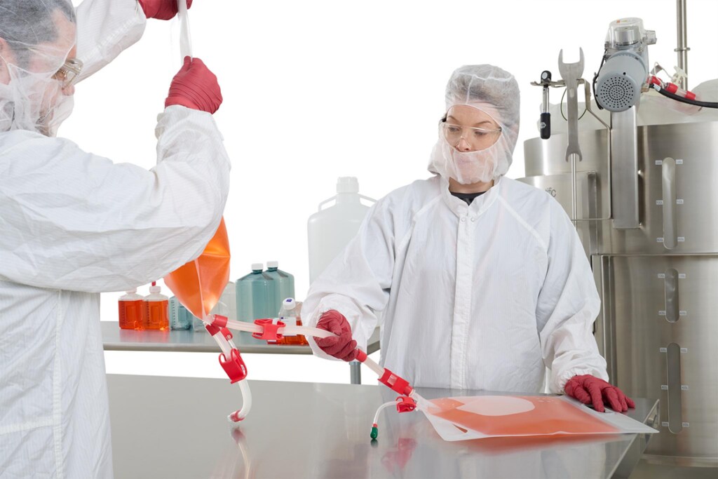 Two scientists working in a lab with BPC bags