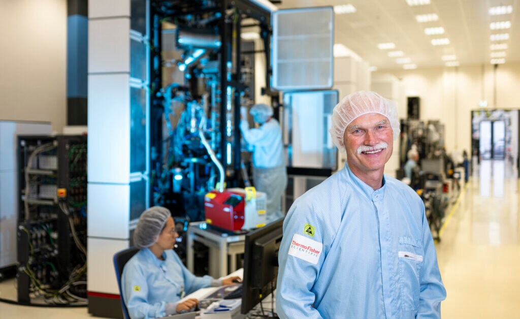 Factory Director Alex Jonkers stands in front of electron microscopy technology manufacturing site