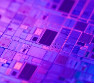 Macro of silicon wafer semiconductor with neon color - integrated circuits to manufacture CPU and GPU