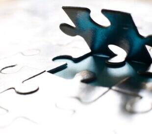 image of Fitting in a Jigsaw piece backlit
