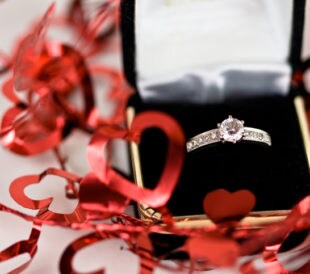 ring in box with Valentine heart decorations