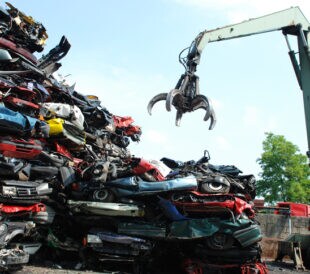 metal recycling of cars at scrapyard