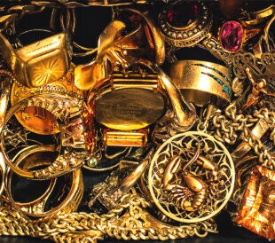gold jewelry, closeup in dark