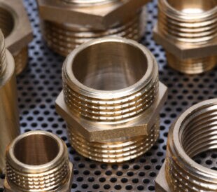 Brass Fittings for Water and Gas on Metal Surface