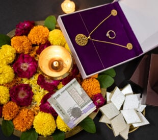 Diwali Puja Thali With Flowers, Diya, And Gifts