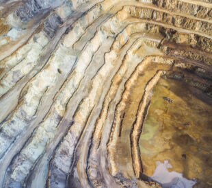 Deep excavation hole of an open pit mine for rare earth elements