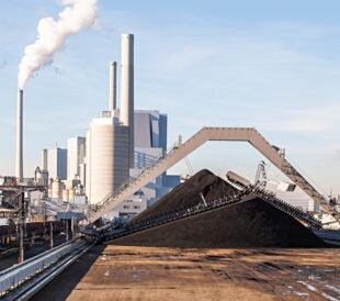 Coal Fired Power Plant with Smokestacks under Blue Sky