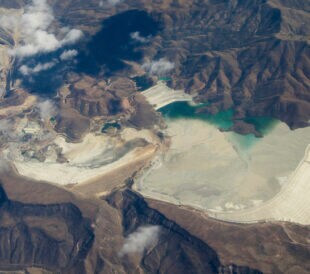 Aerial view of mine tailings from the Bagdad Mine, an open pit copper mine in Bagdad, Arizona, USA. Mine is just off to the left.