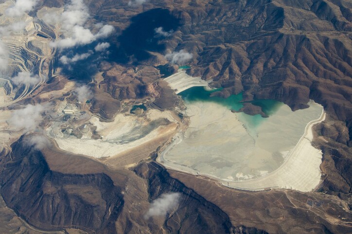 Aerial view of mine tailings from the Bagdad Mine, an open pit copper mine in Bagdad, Arizona, USA. Mine is just off to the left.