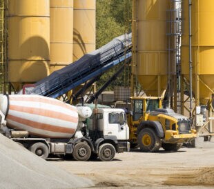 Concrete trucks in front of cement factory