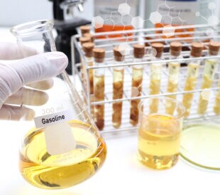 Yellow Gasoline oil extracted from natural raw material, laboratory experiment