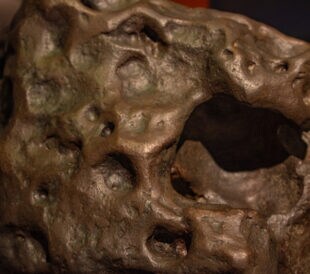 Fragment of meteorite, close up.