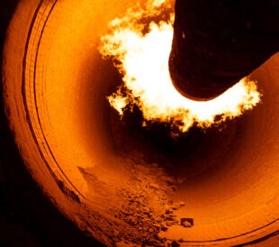 A closeup of a rotary kiln for clinker production in a cement plant