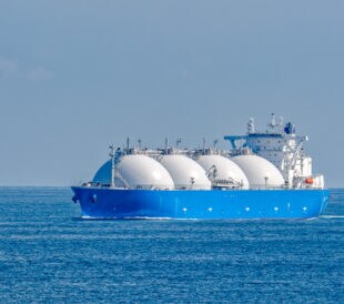 Liquefied natural gas (LNG) tanker is passing by Strait of Singapore.