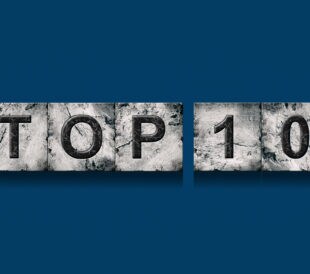 Top 10, words, isolated on a dark blue background. Alphabet on stone blocks.Rating. Rating concept. Background.