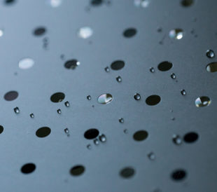 Liquid moving through holes in a membrane. Image: omihay/Shutterstock.com