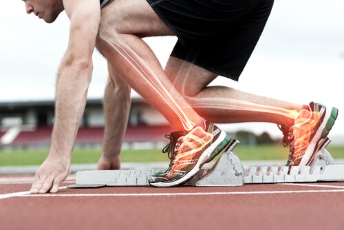 Digital composite of highlighted bones of man about to race. Image: ESB Professional/Shutterstock.com.